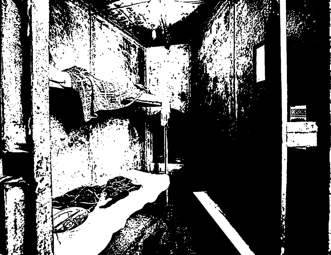 Forth spread of the zine. It's a full spread black and white posterized image of one of the jail cells. 
                    It's wedge shaped and the back of the cell is very narrow. It has bunk beds on the left.